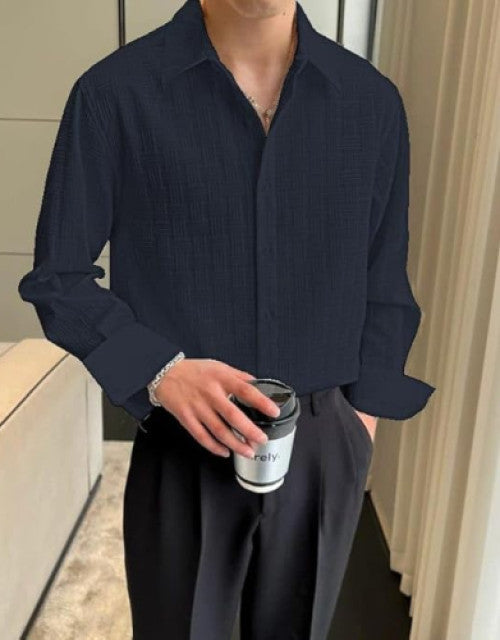 Expertly crafted with a cotton blend, this men's long sleeve shirt offers a comfortable and regular fit. Perfect for any occasion, this classic shirt is versatile and stylish. The blend of cotton ensures breathability and softness while the regular fit provides a flattering silhouette.