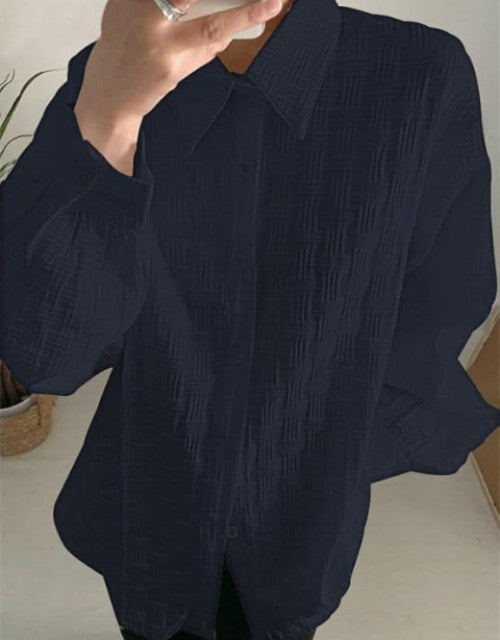 Expertly crafted with a cotton blend, this men's long sleeve shirt offers a comfortable and regular fit. Perfect for any occasion, this classic shirt is versatile and stylish. The blend of cotton ensures breathability and softness while the regular fit provides a flattering silhouette.