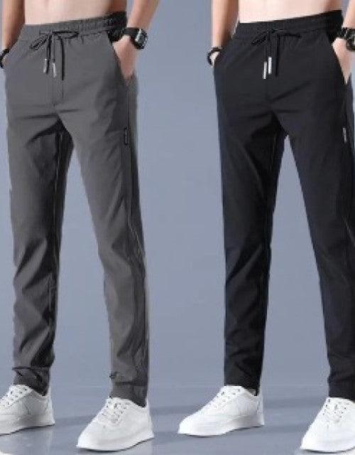 Upgrade your workout wardrobe with these Men's Solid Track Pants. Made with high-quality materials, these pants provide complete comfort and flexibility during any physical activity. With a pack of two, you'll always have a clean pair ready when you need it. Perfect for any active lifestyle.