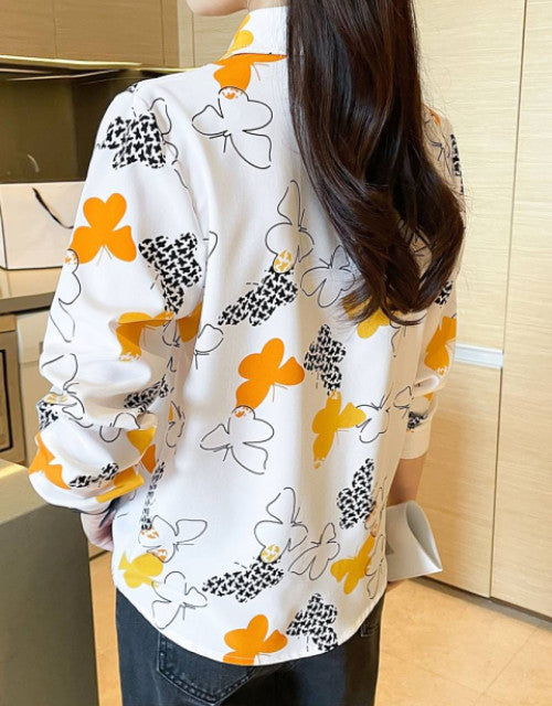 Expertly crafted women's casual shirt featuring a regular fit silhouette with tasteful printed patterns. The versatile design transitions effortlessly from day to evening wear, while quality fabric ensures comfort during extended wear. Perfect for pairing with jeans, trousers, or skirts for a polished yet relaxed appearance.